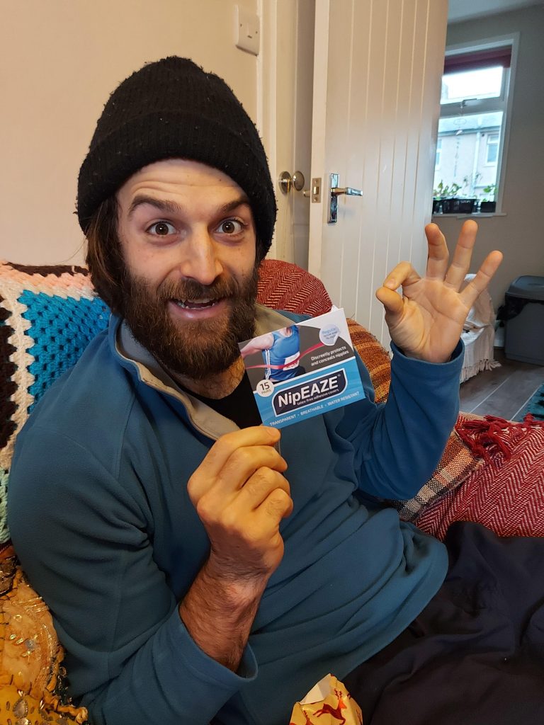 Man holding nipple running patches