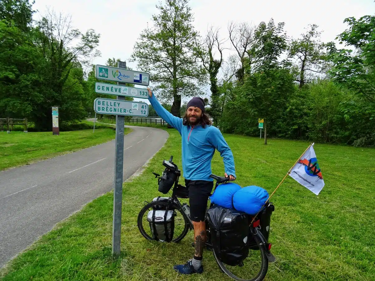 Via Rhona man on bike next to bike sign