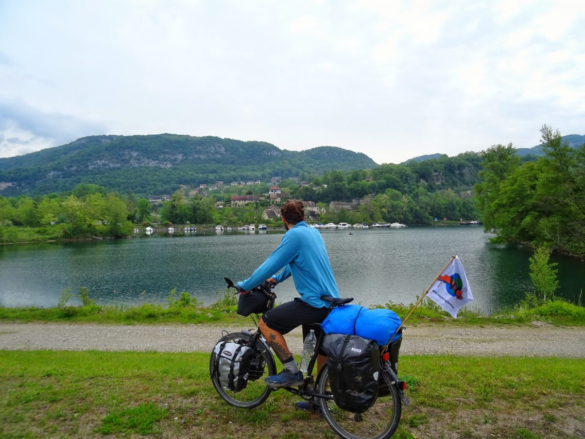 Man bike touring near lake