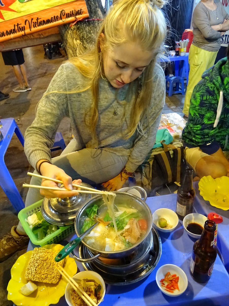 Girl eating vegan hot pot in Vietnam
