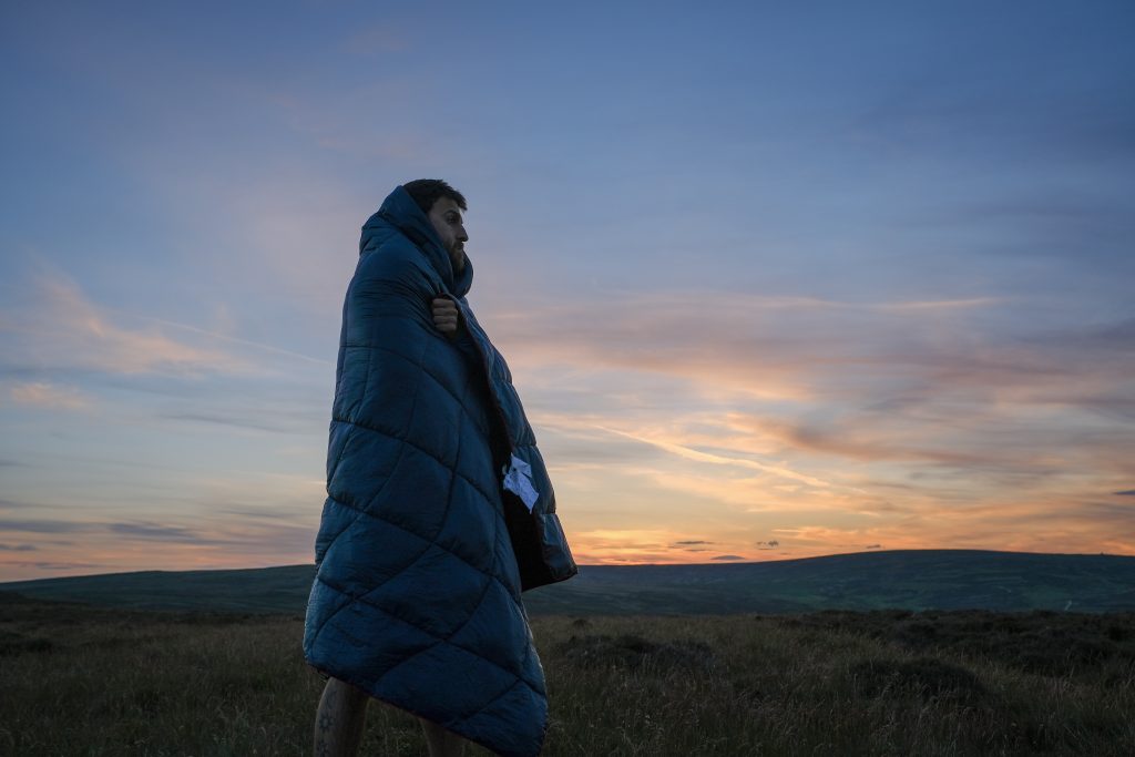 Camper watching sunset
