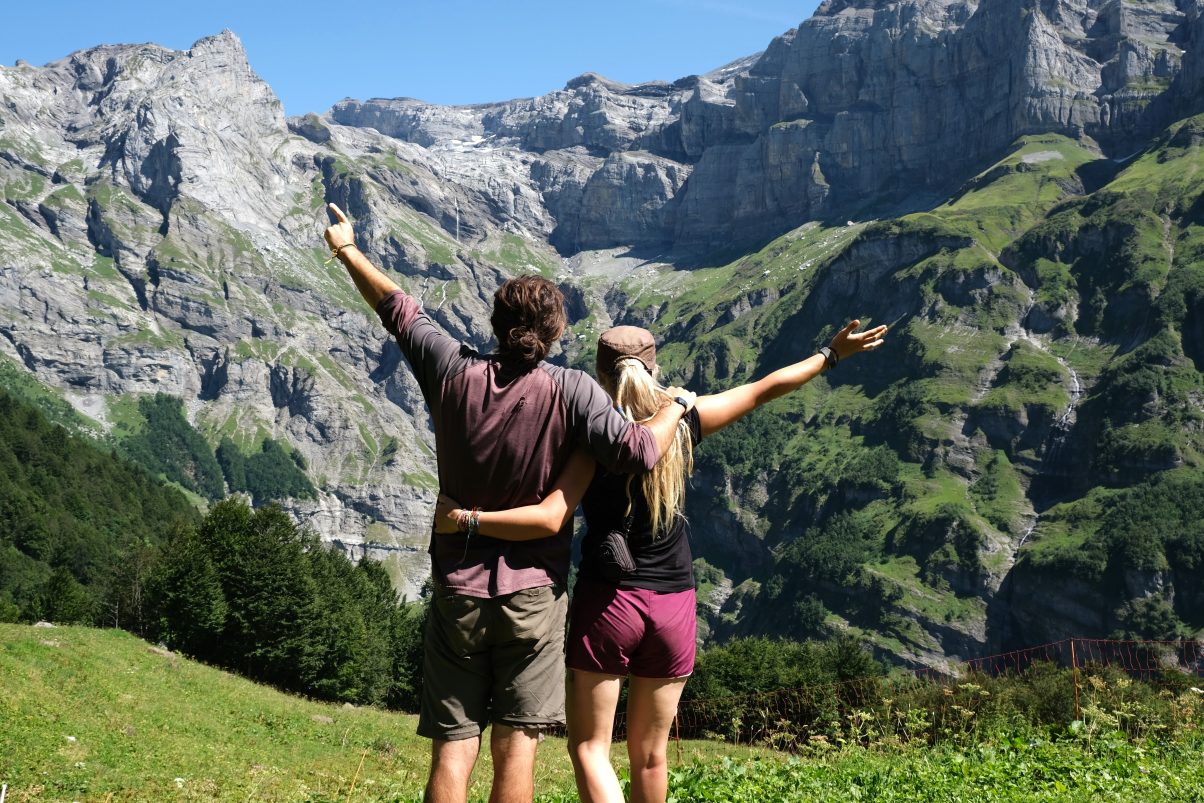 Couple overlooking Alps Mountains