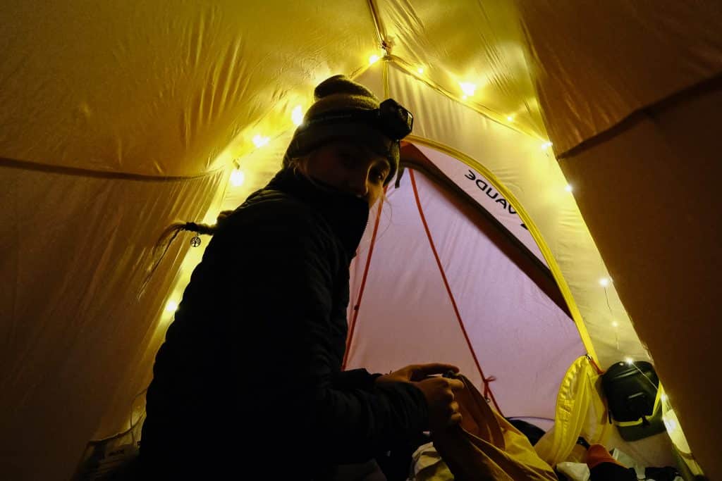 Girl camping in a tent