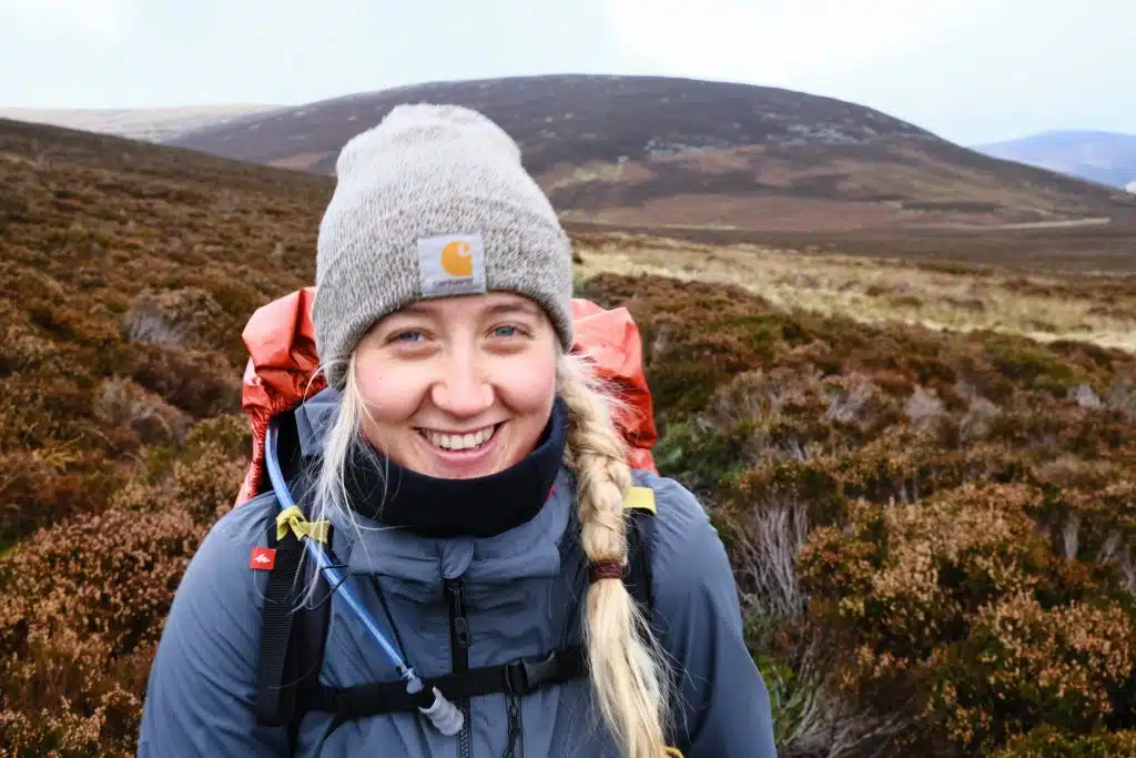 Girl hiking through the Lake District wearing waterproof clothing