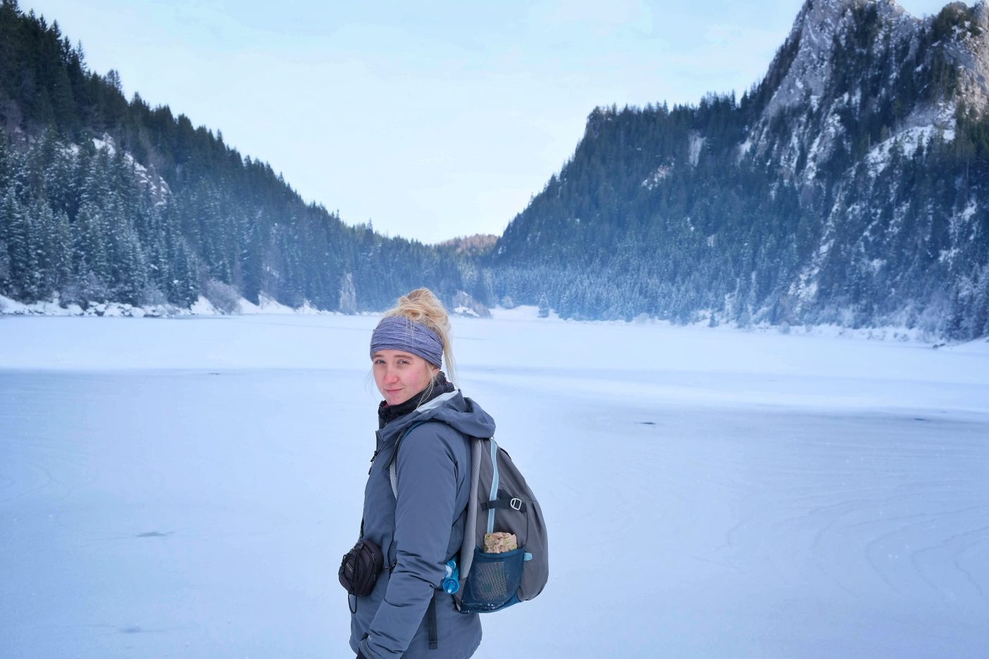 Girl on egde of Lac de Tanay in winter 
