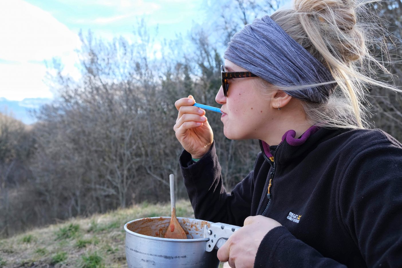 Hiker eating meal of B12 vegan foods