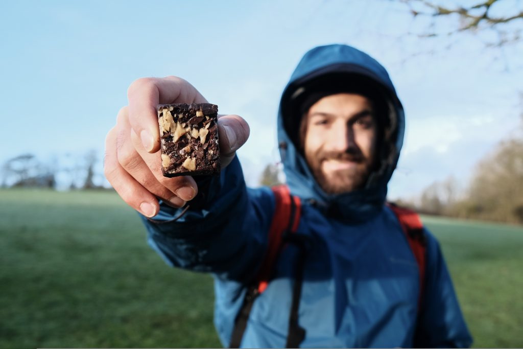 Man holding peanut butter fudge without milk