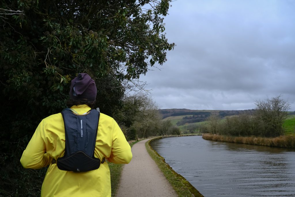 Man running along canal
