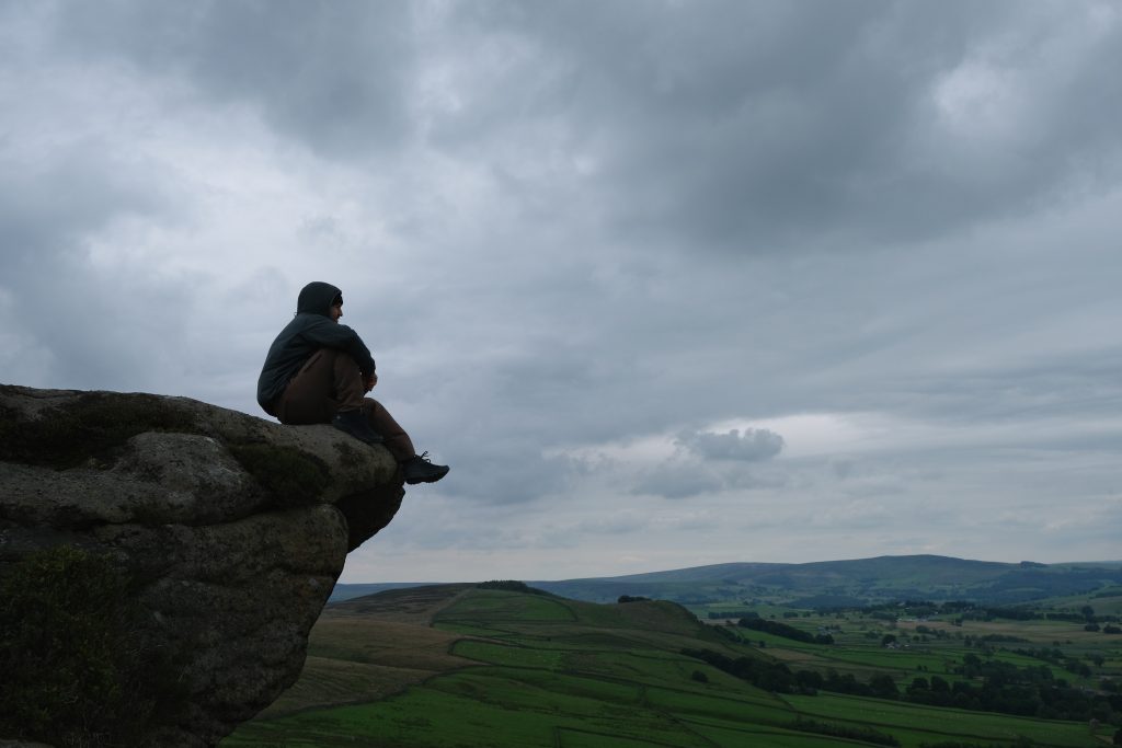 Man sitting on mountainside