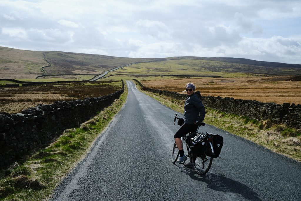 Girl cycling in second-hand cycling gear