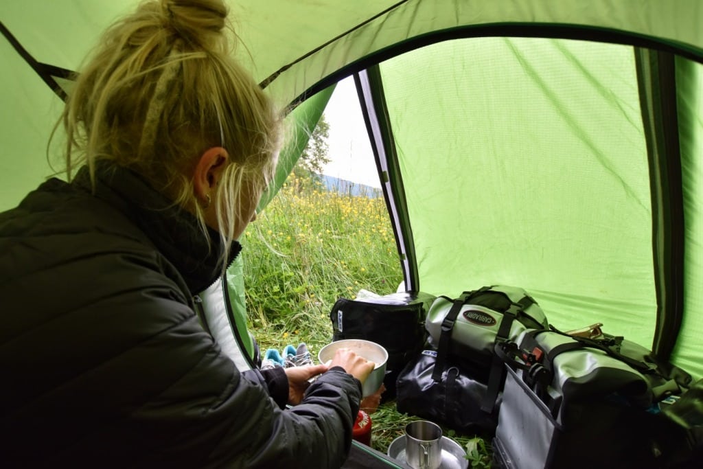Girl cooking in tent