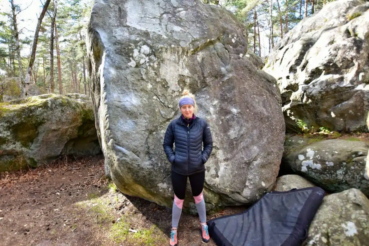 Female climber with crash pad