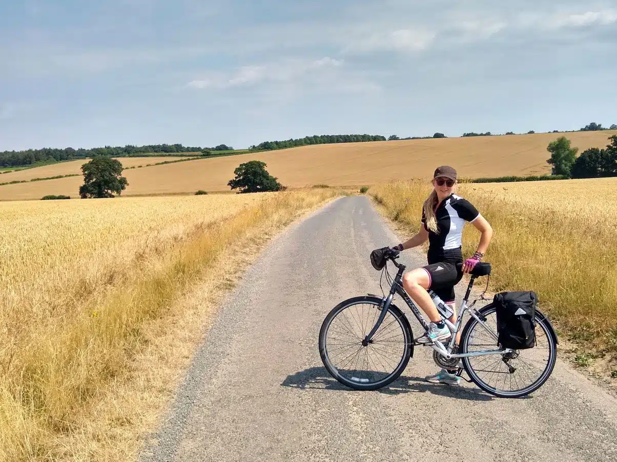 Girl cycling on bike tour camping trip