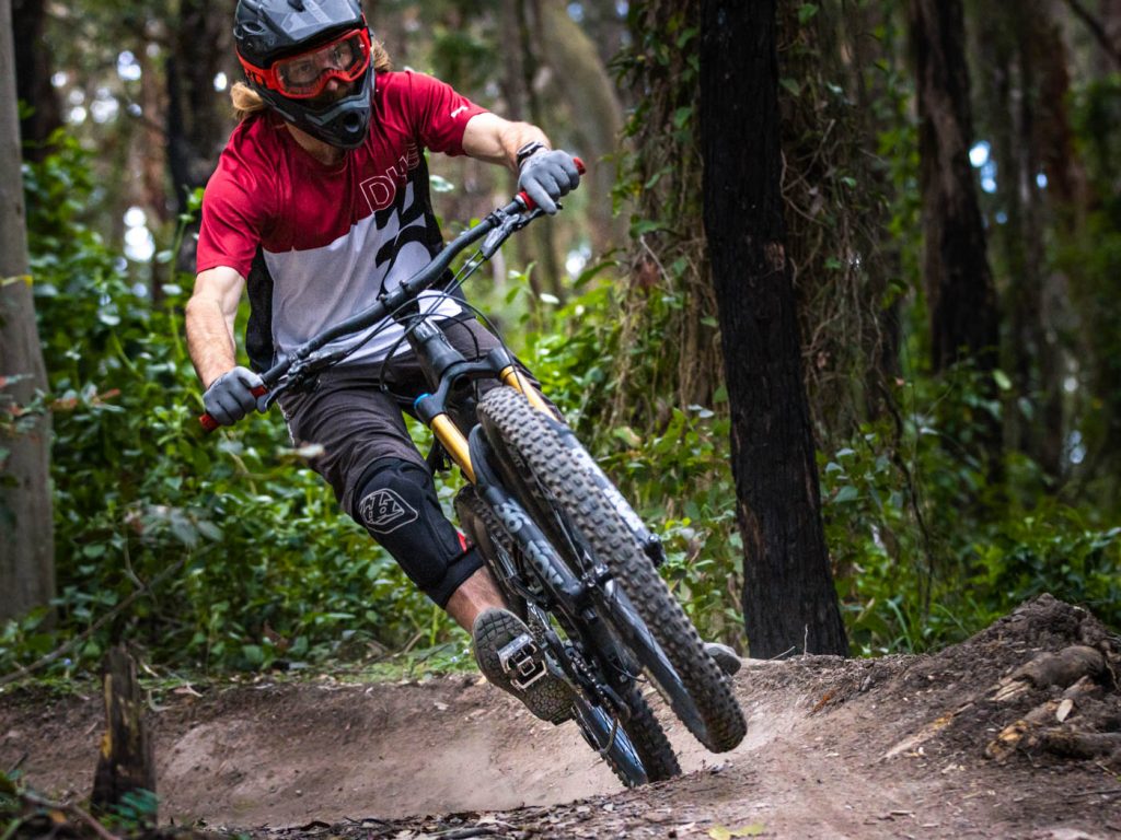 Female mountain biker on dirt track
