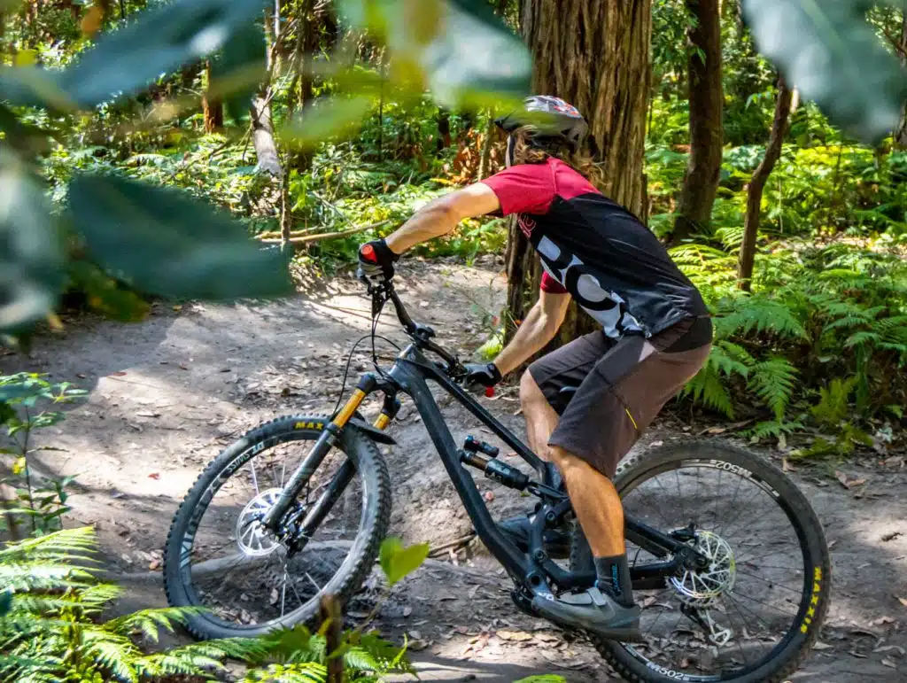 beginner mountain biker turning a corner