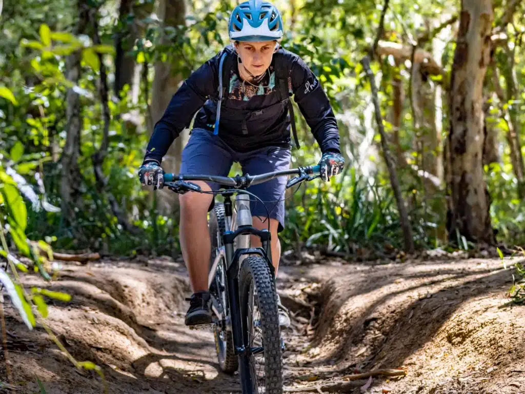 Mountain biking girl go over mu