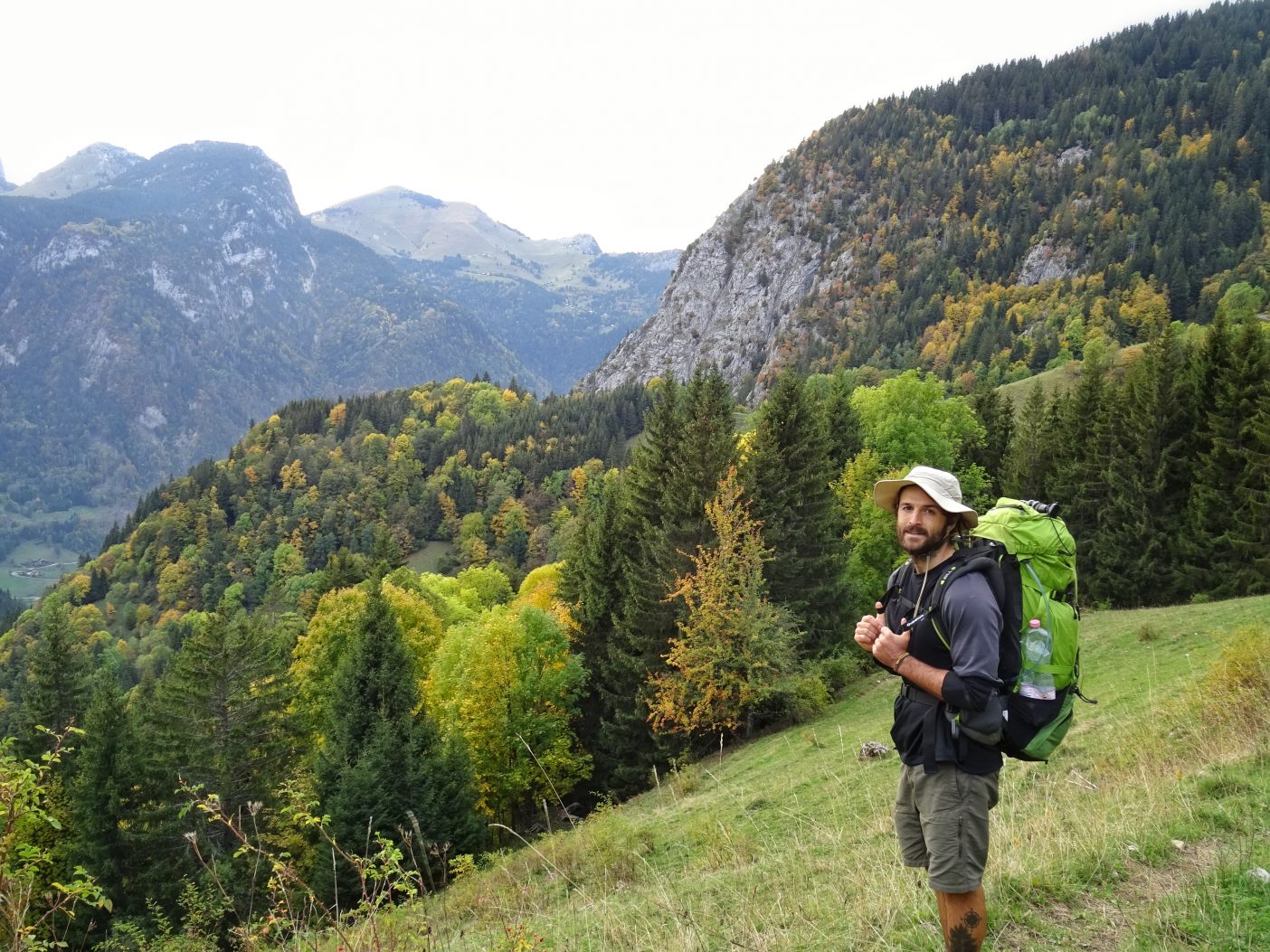 Full time backpackers travelling on mountain 