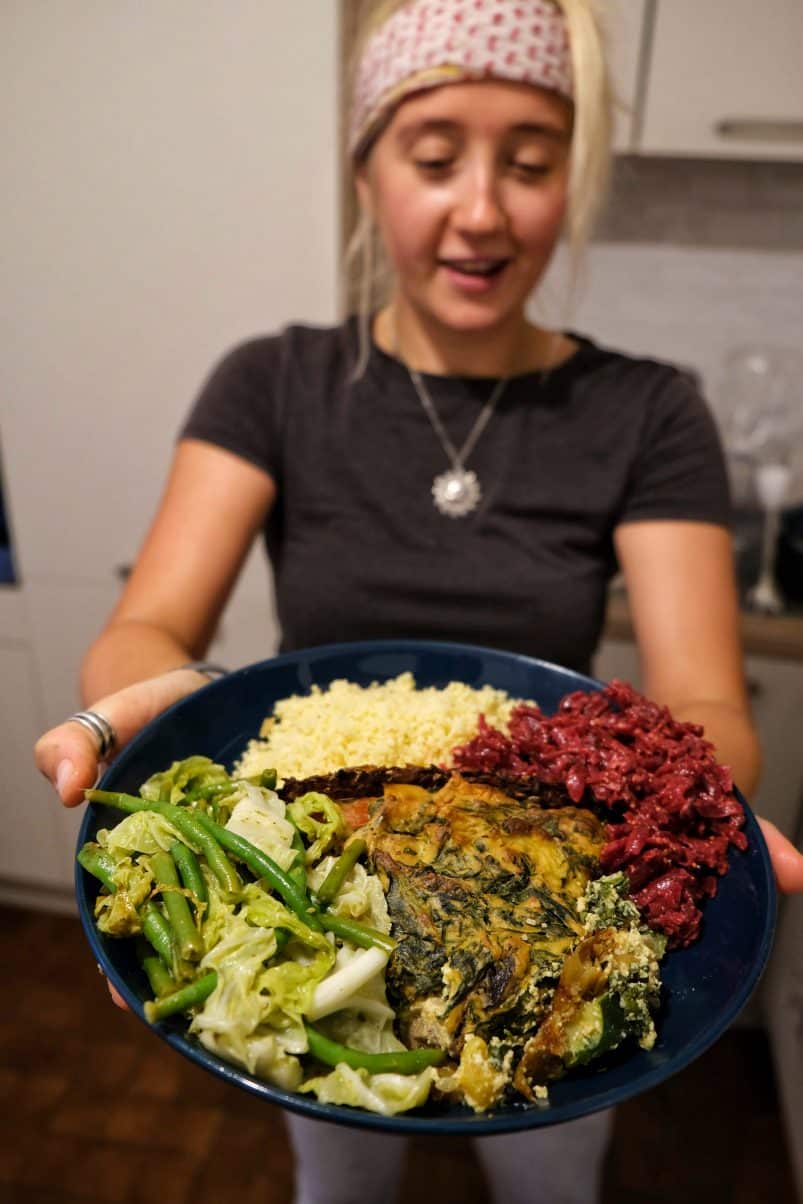 Girl holding plate of food 