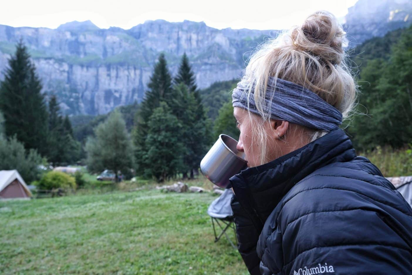Girl drinking when camping 