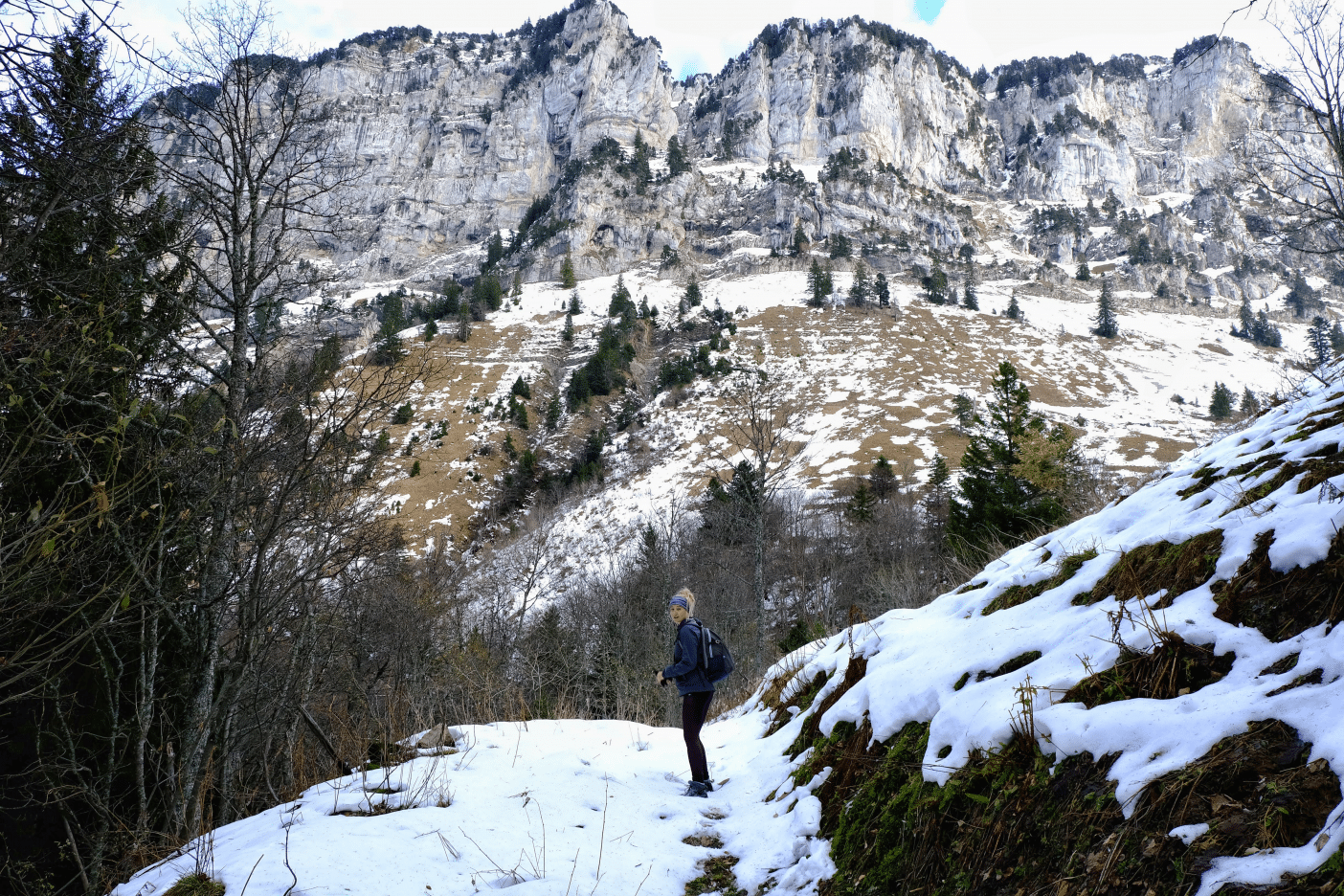Girl in front of snowy mountain