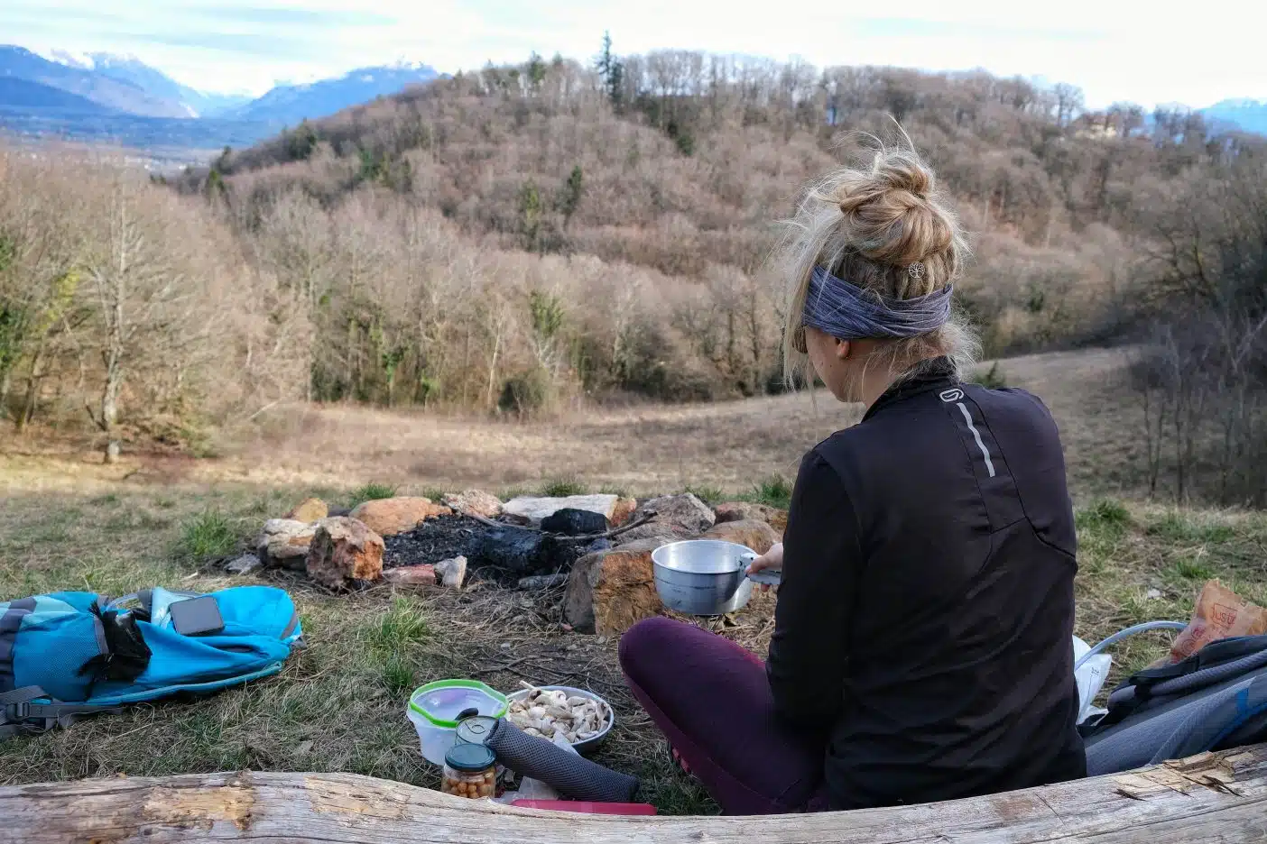 Girl making vegan backpacking meals 