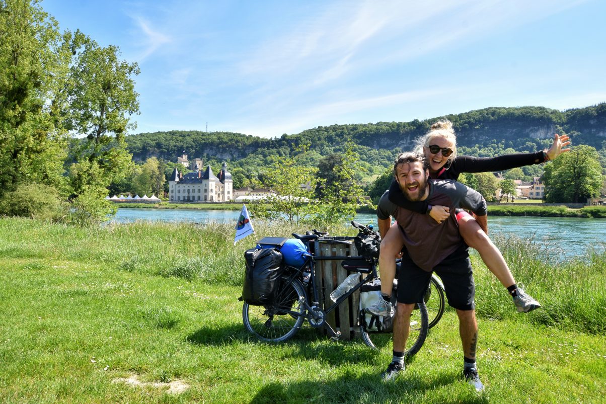 Man and women biker touring looking happy