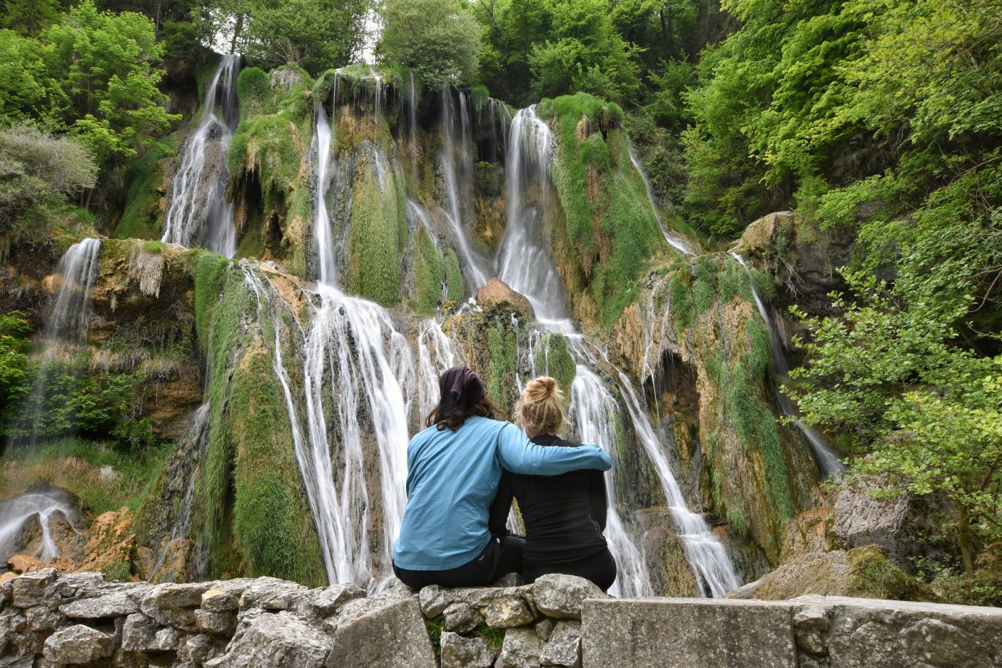 Couple in front of waterfall 