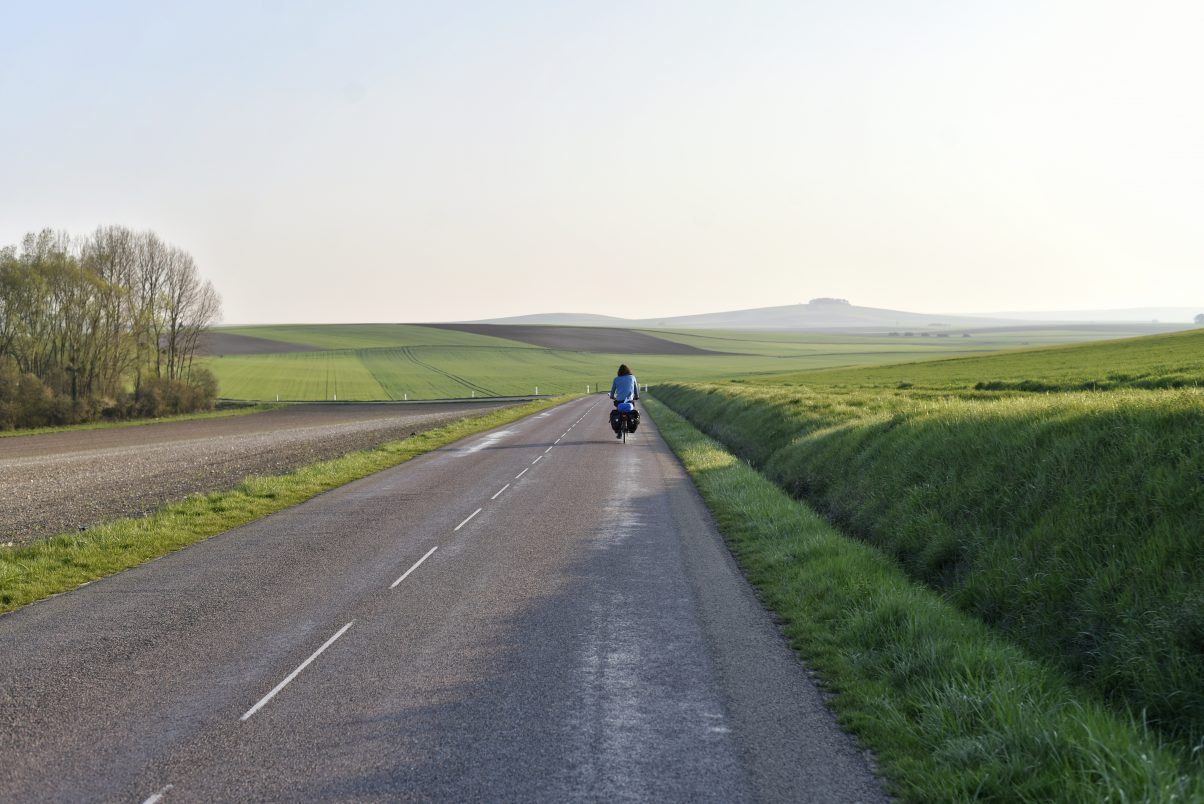 Man riding bike touring route